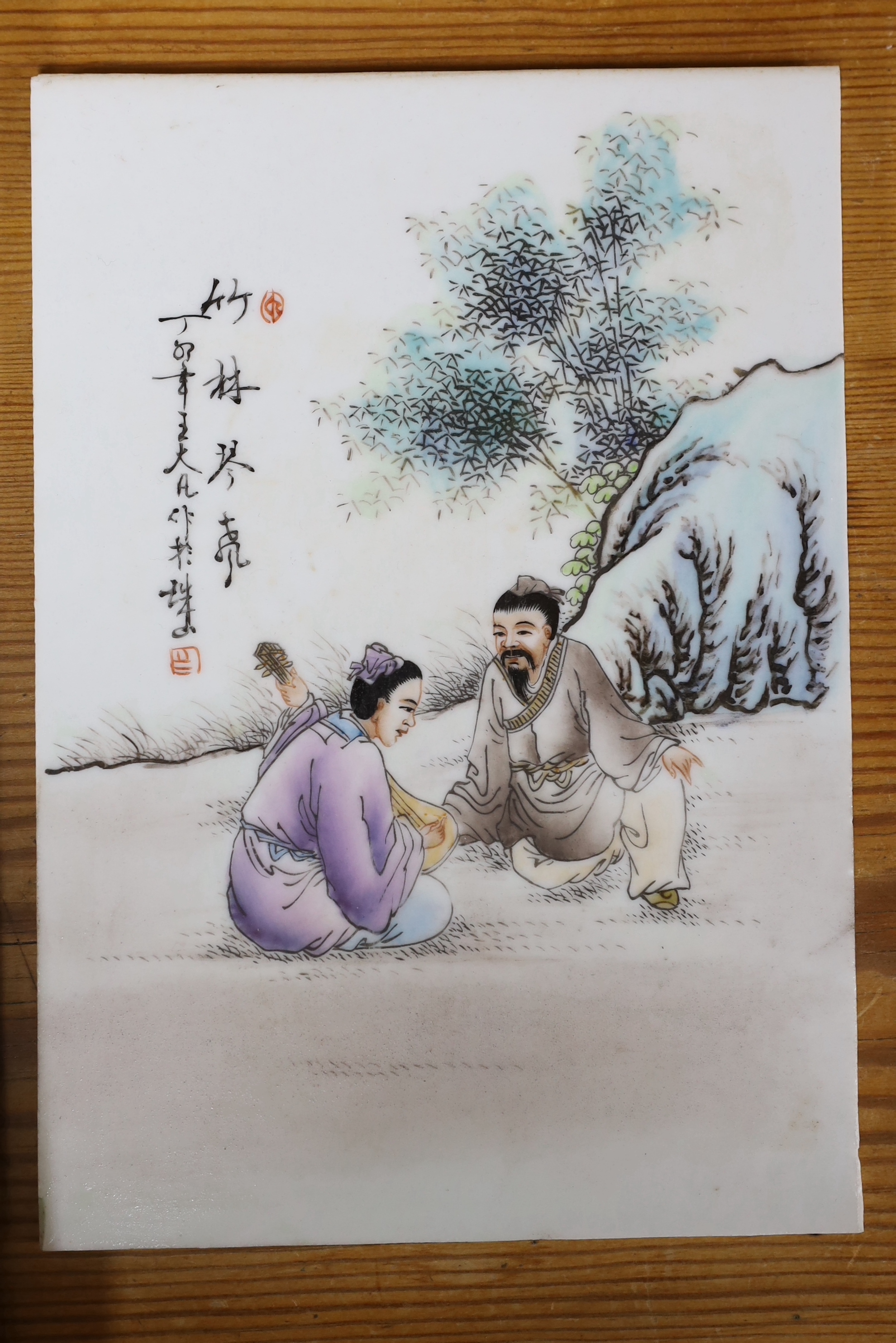 An early 20th century Chinese famille rose plaque and two others, largest 36cm high x 24.5cm wide